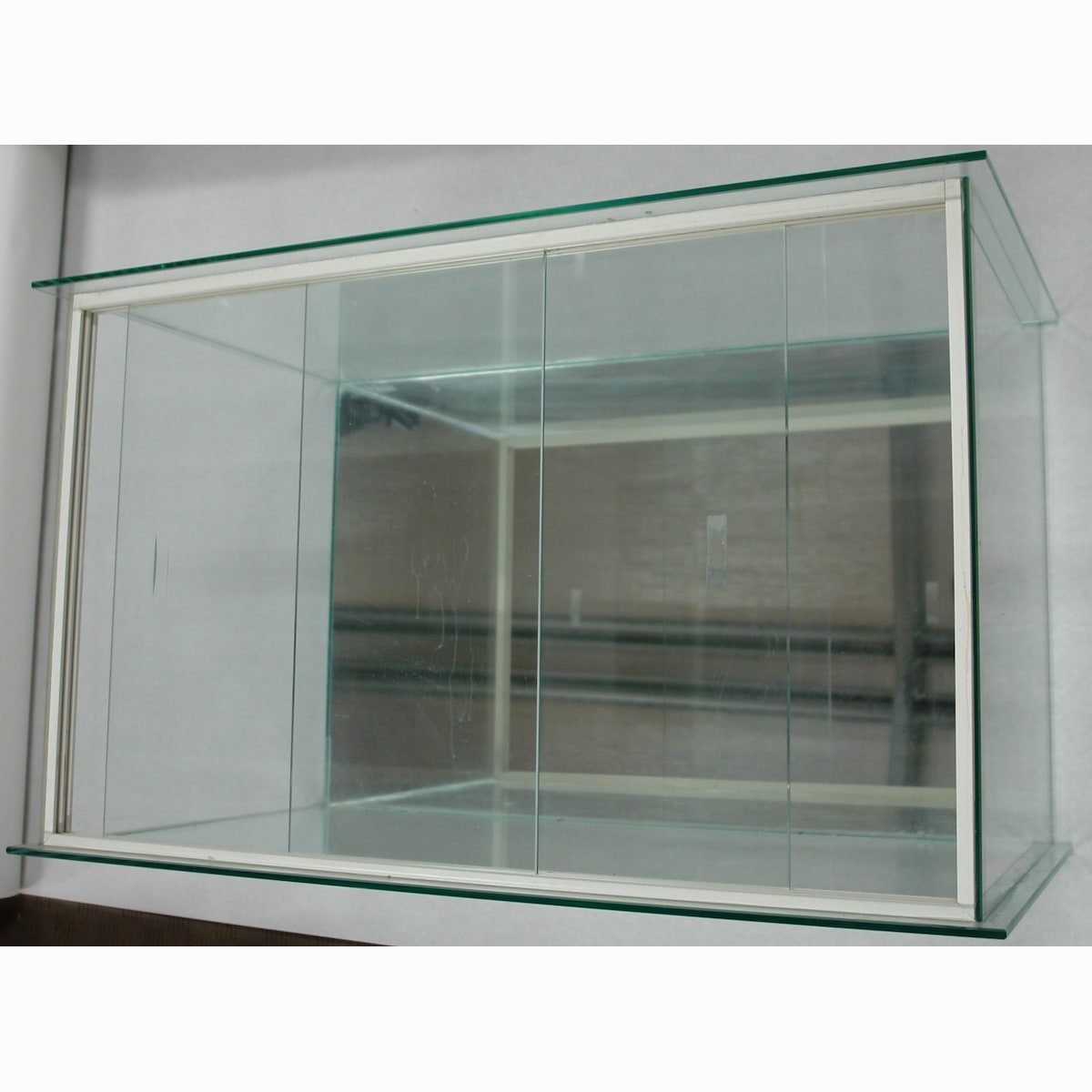 Smaller display cabinet. Not for standard post. Winning Bidder will have to make arrangements for pickup or courier delivery.