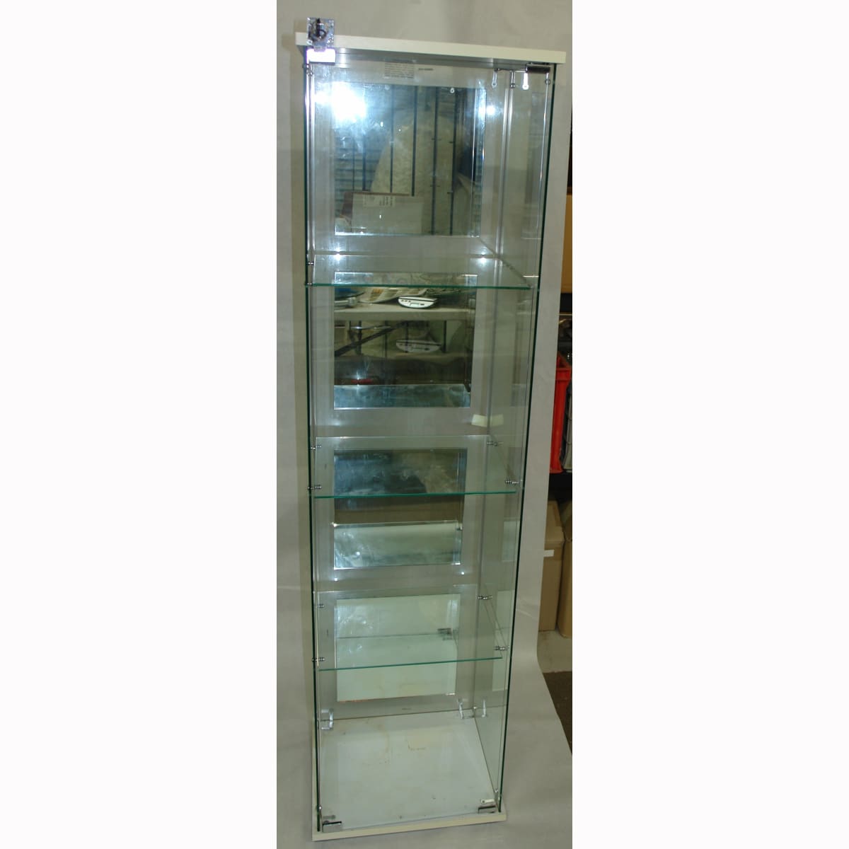 Tall square display cabinet. Not for standard post. Winning Bidder will have to make arrangements for pickup or courier delivery.