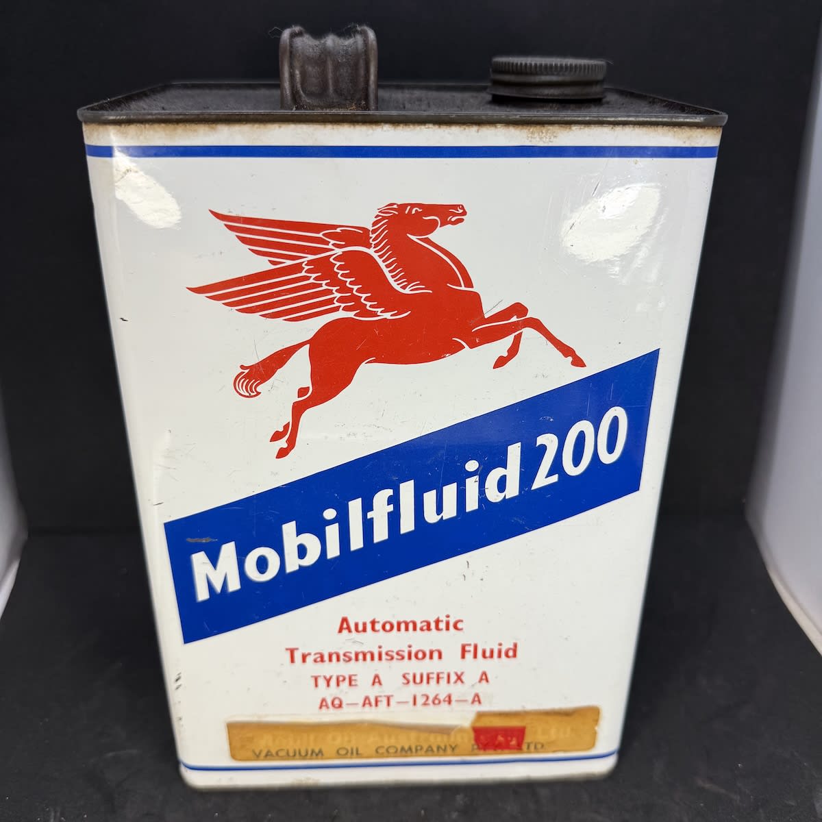 Oil Tin. Mobilfluid 200. Pegasus facing right. Automatic Transmission Fluid. Mobiloil Australia Pty Ltd. Vacuum Oil Company Pty Ltd.