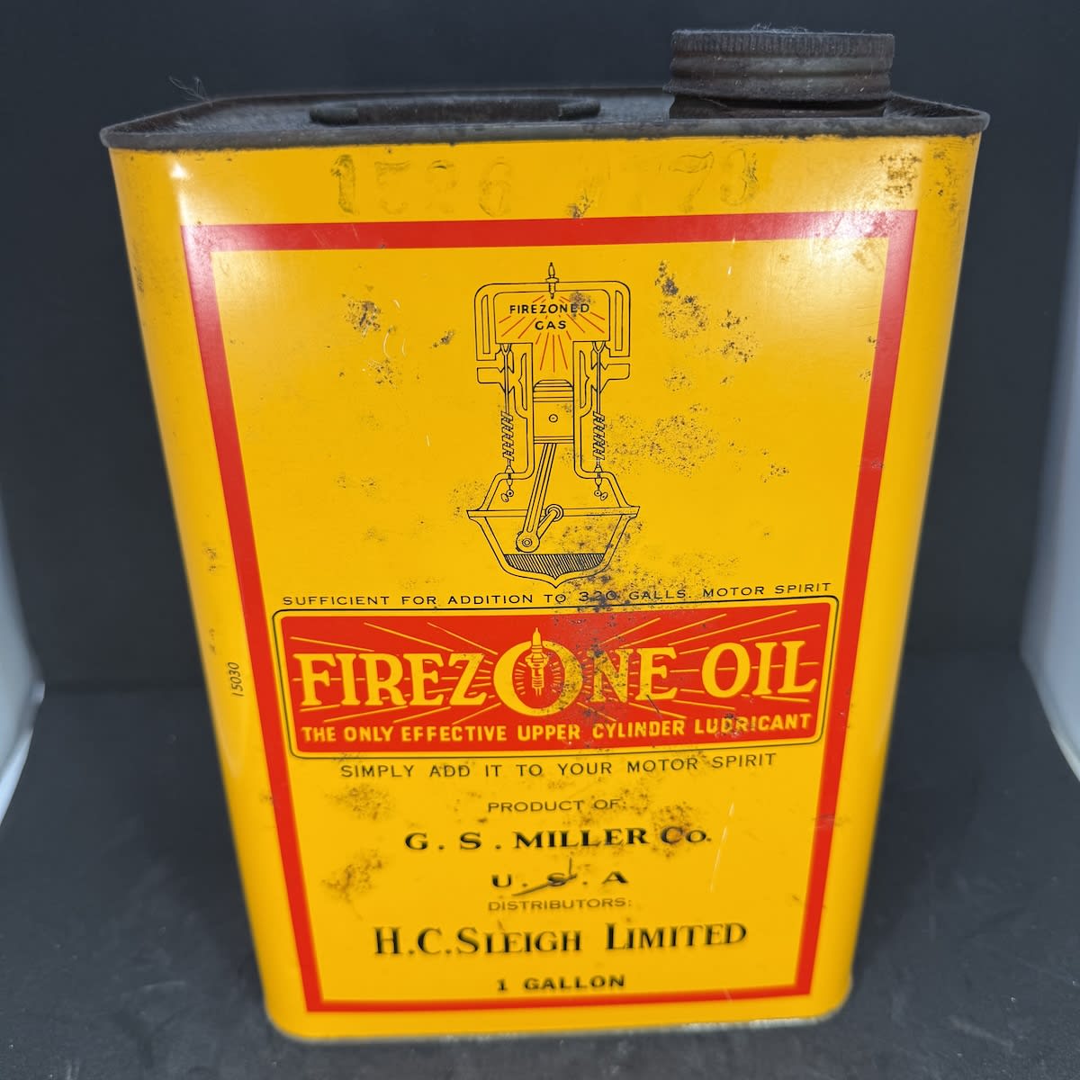 Oil Tin. Firezone Oil. Upper Cylinder Lubricant. G. S. Miller Co USA. Distributors H. C. Sleigh Limited. 1 Gallon. Golden Fleece embossed lid.