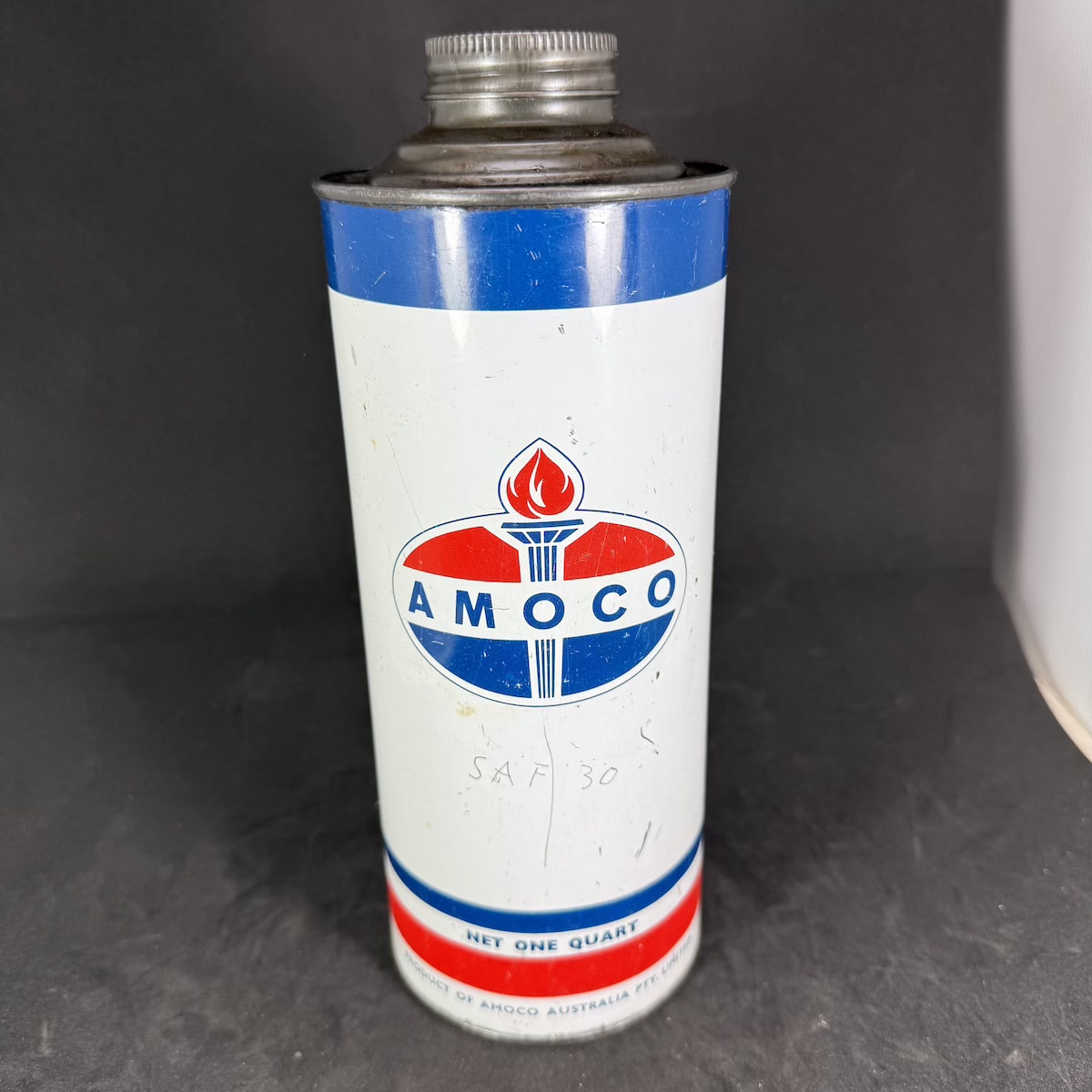 Oil Tin. Amoco Australia Pty Ltd. Torch. Red & Blue on White. Quart.