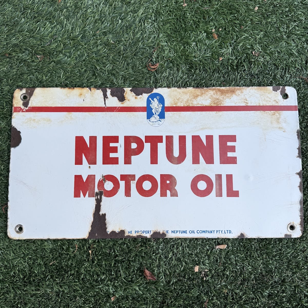 Enamel Sign. Neptune Motor Oil. King Neptune on a barrel of Neptune Oil. Neptune Oil Company Pty Ltd.