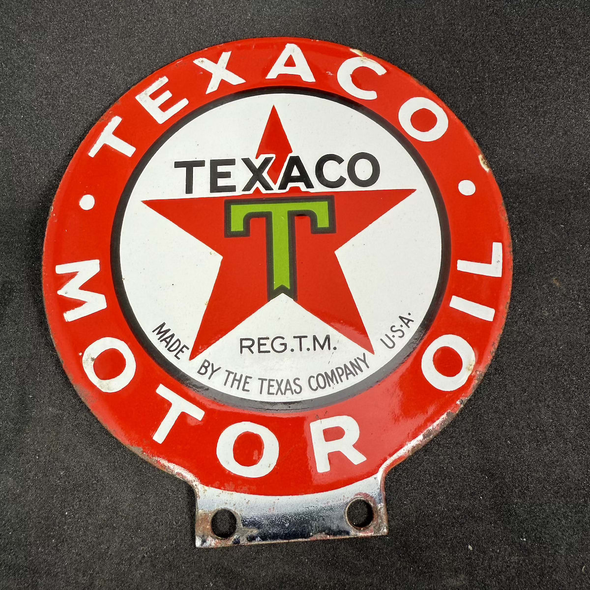 Small round double sided enamel sign. Texaco Motor Oil. Made by the Texas Company U. S. A. Green T with black outline on red star.
