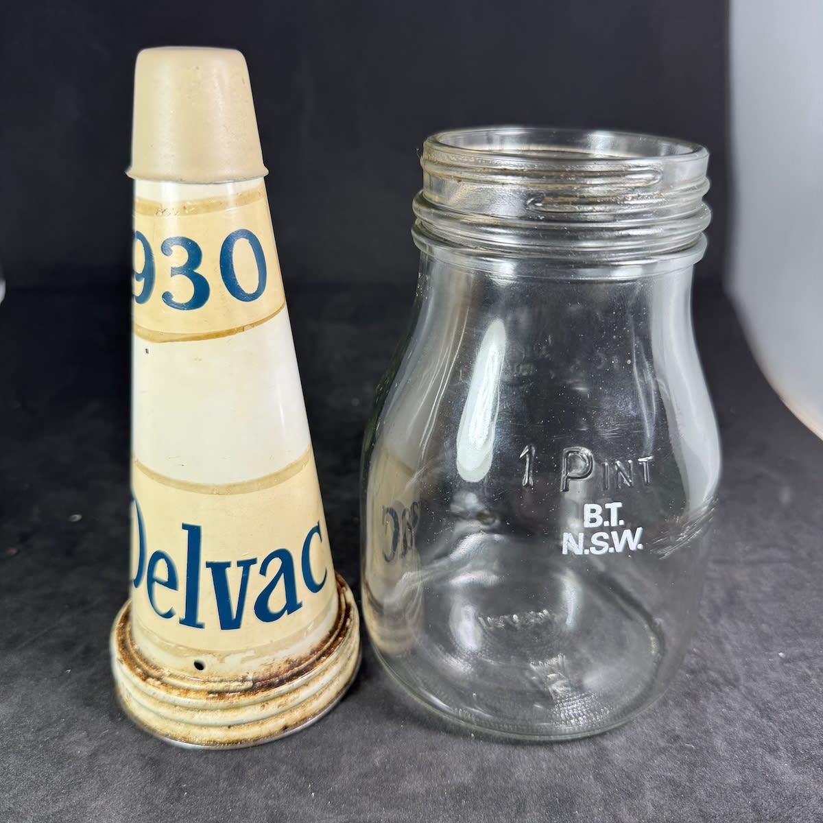 Pint Oil bottle with tin top. Delvac 930. Generic Pint Bottle B. T. N. S. W. ceramic label.