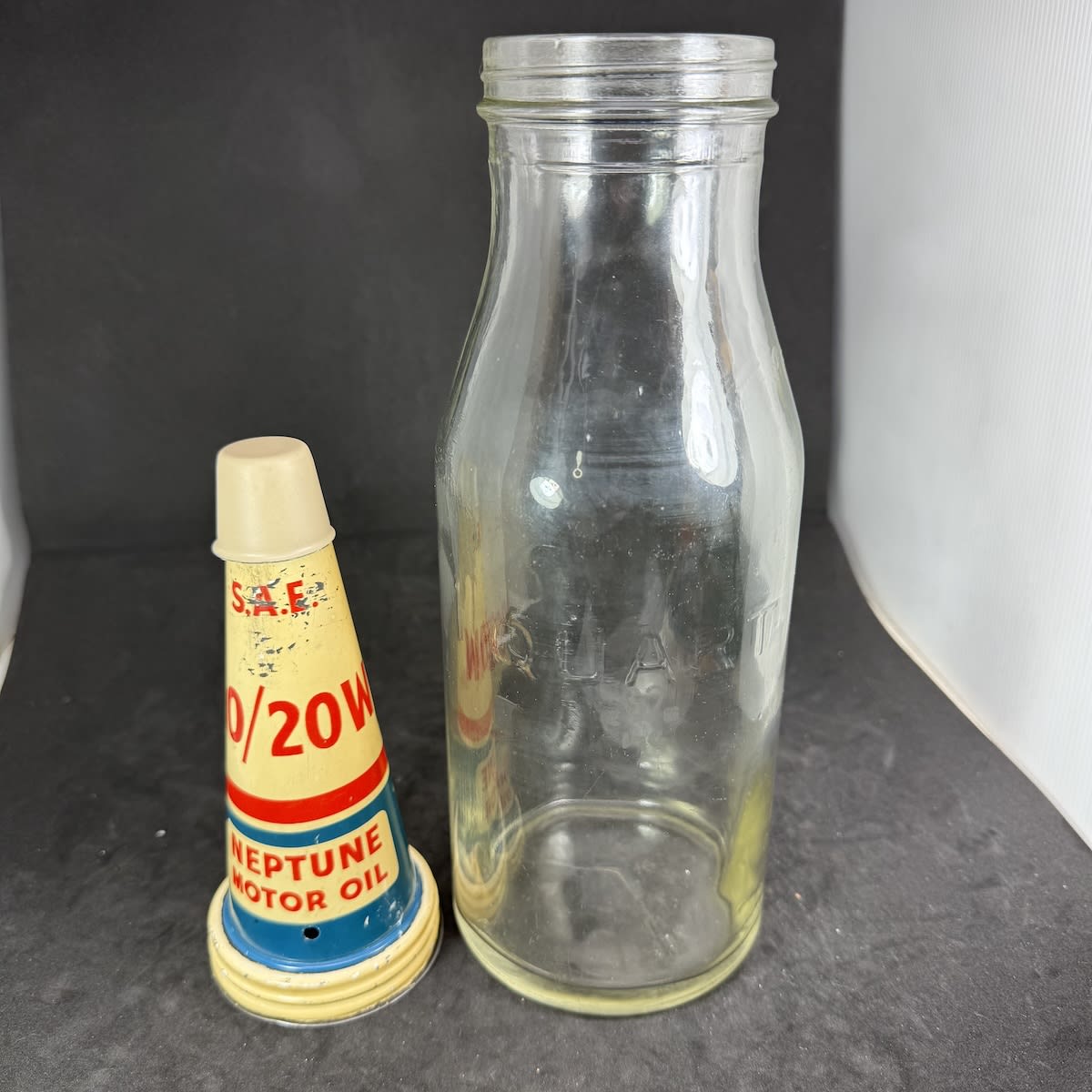 Quart Oil bottle with tin top pourer. Neptune Motor Oil. Generic Quart bottle.
