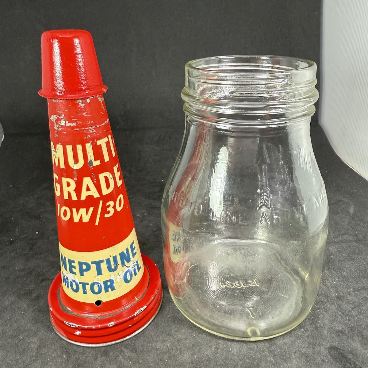 Pint oil bottle with tin top pourer. Neptune Motor Oil. Multi grade. Generic pint bottle.