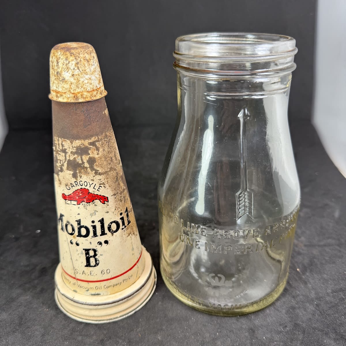 Pint Oil Bottle with Tin Top Pourer. Gargoyle Mobiloil B. Property of Vacuum Oil Company Pty Ltd Bottle.
