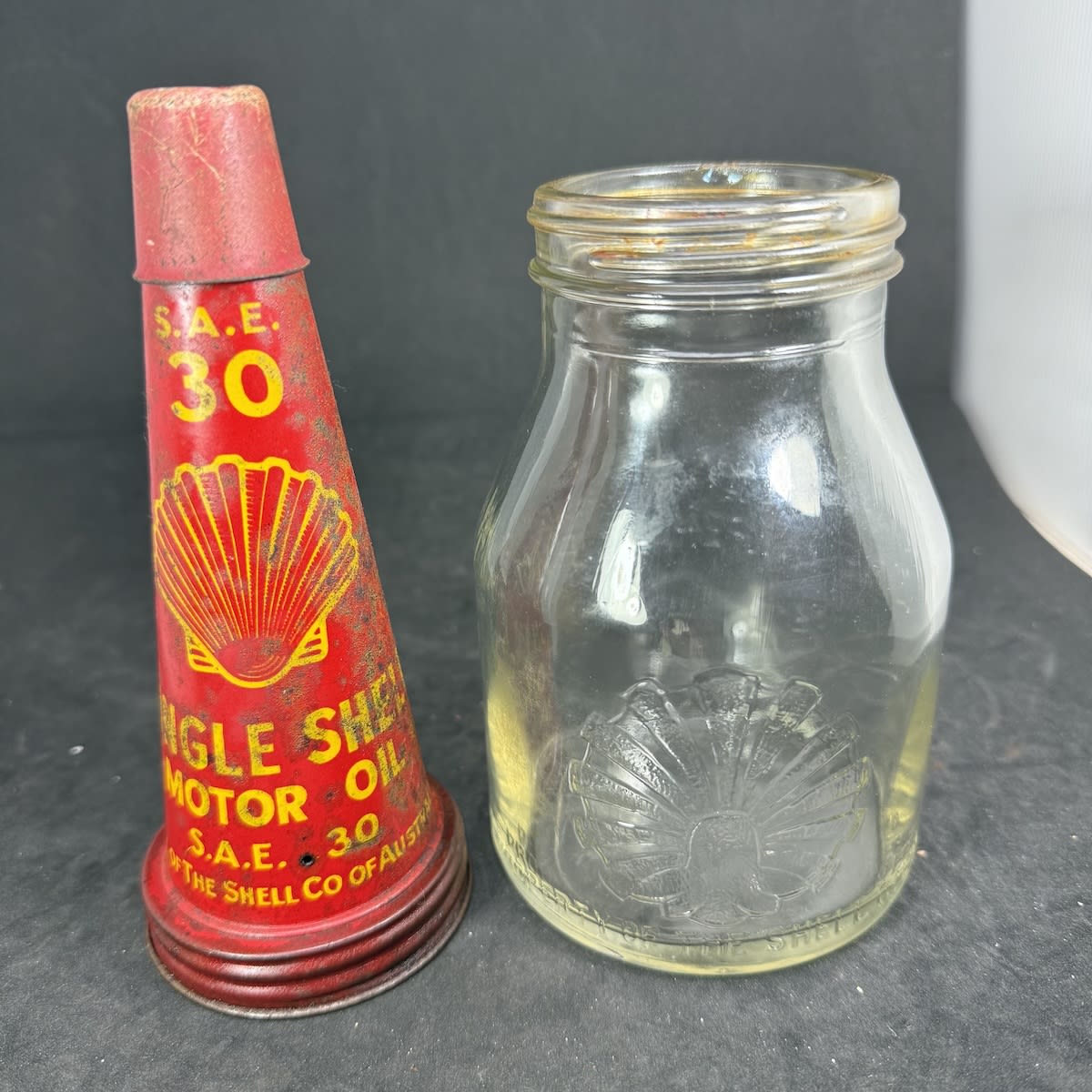 Pint Oil Bottle with Tin Top Pourer. Single Shell Motor Oil, The Shell Co of Australia Ltd. Bottle with Shell embossed, The Shell Co Ltd.