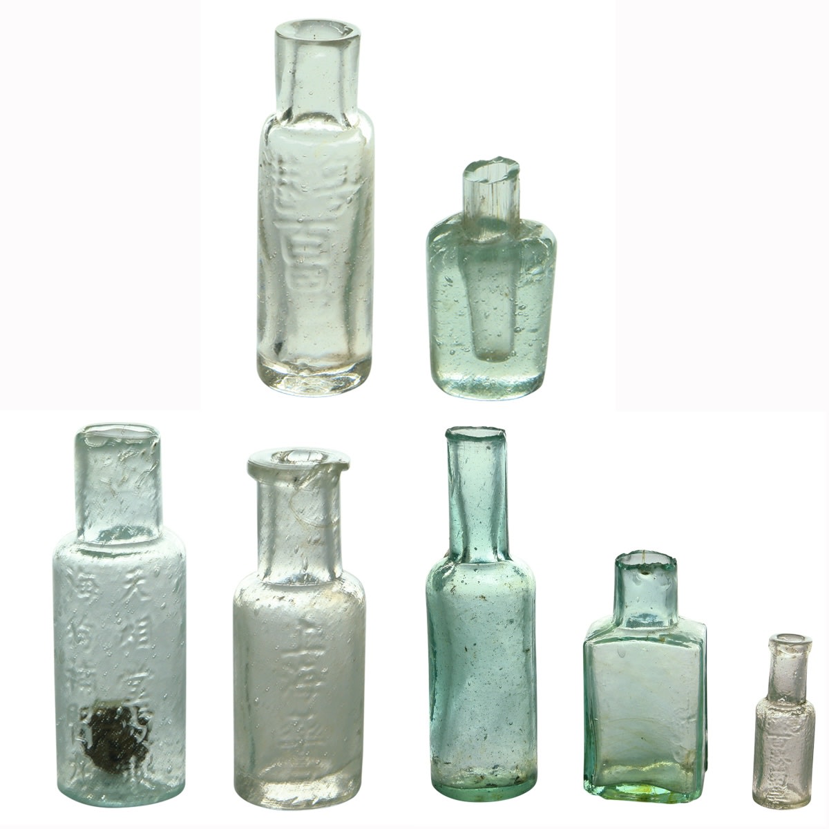 7 Tiny Chinese type bottles.