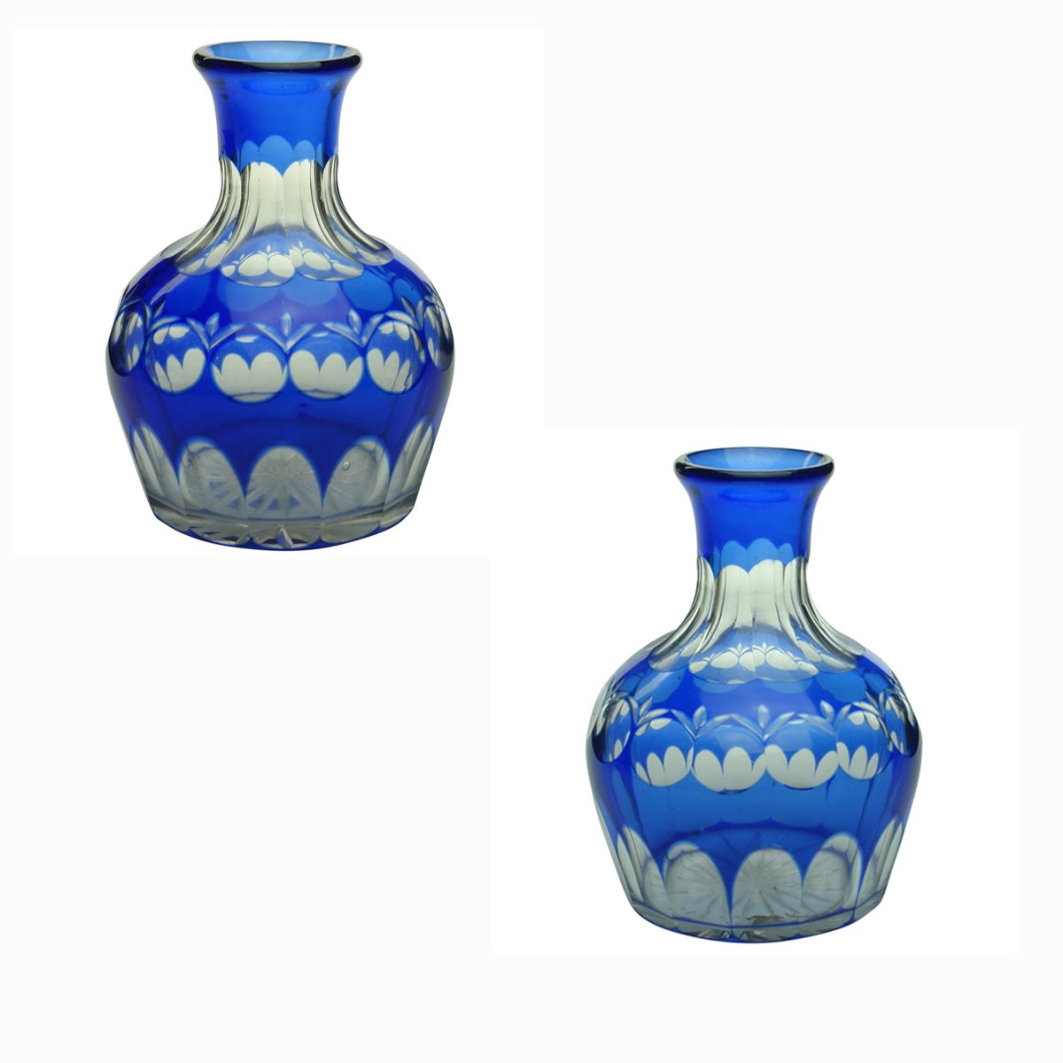 Glassware. Pair of blue and clear cased cut glass decanters.