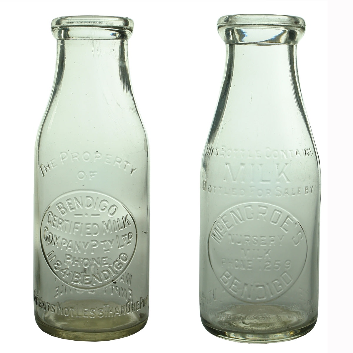 2 Milk Bottles: Bendigo Certified Milk Company Pty Ltd. Straight line AGM base mark; McEncroe's Nursery Milk, Bendigo. Base Number: 562. (Victoria)