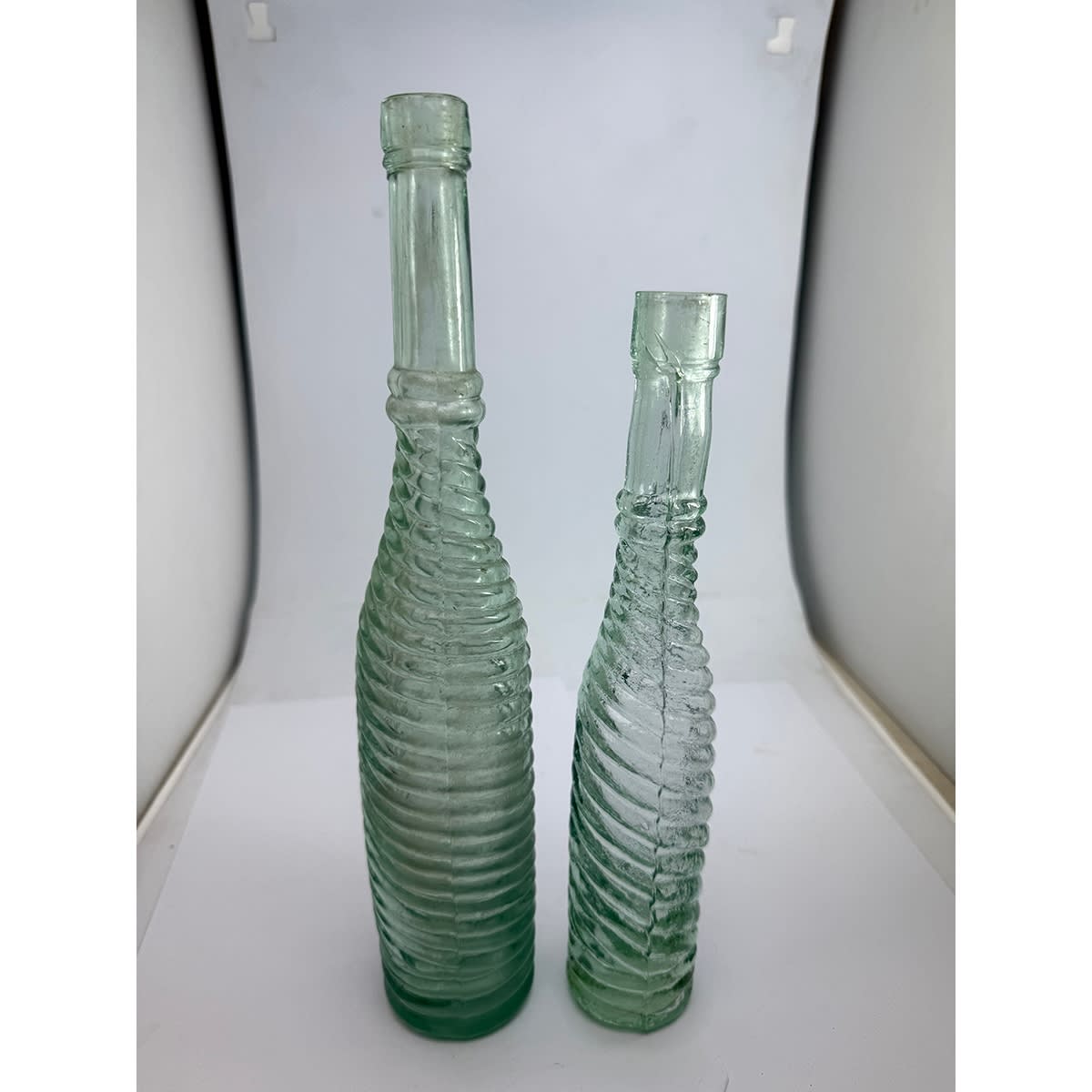 2 Salad Oils. Full whirly patterns in 10 & 5 oz. Smaller one with a chunky spun finished top.