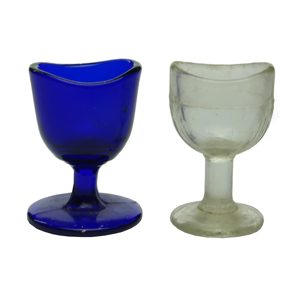 2 Eye Baths: Cobalt Blue Pedestal Base Eye Bath; Clear Pedestal Base Eye Bath.