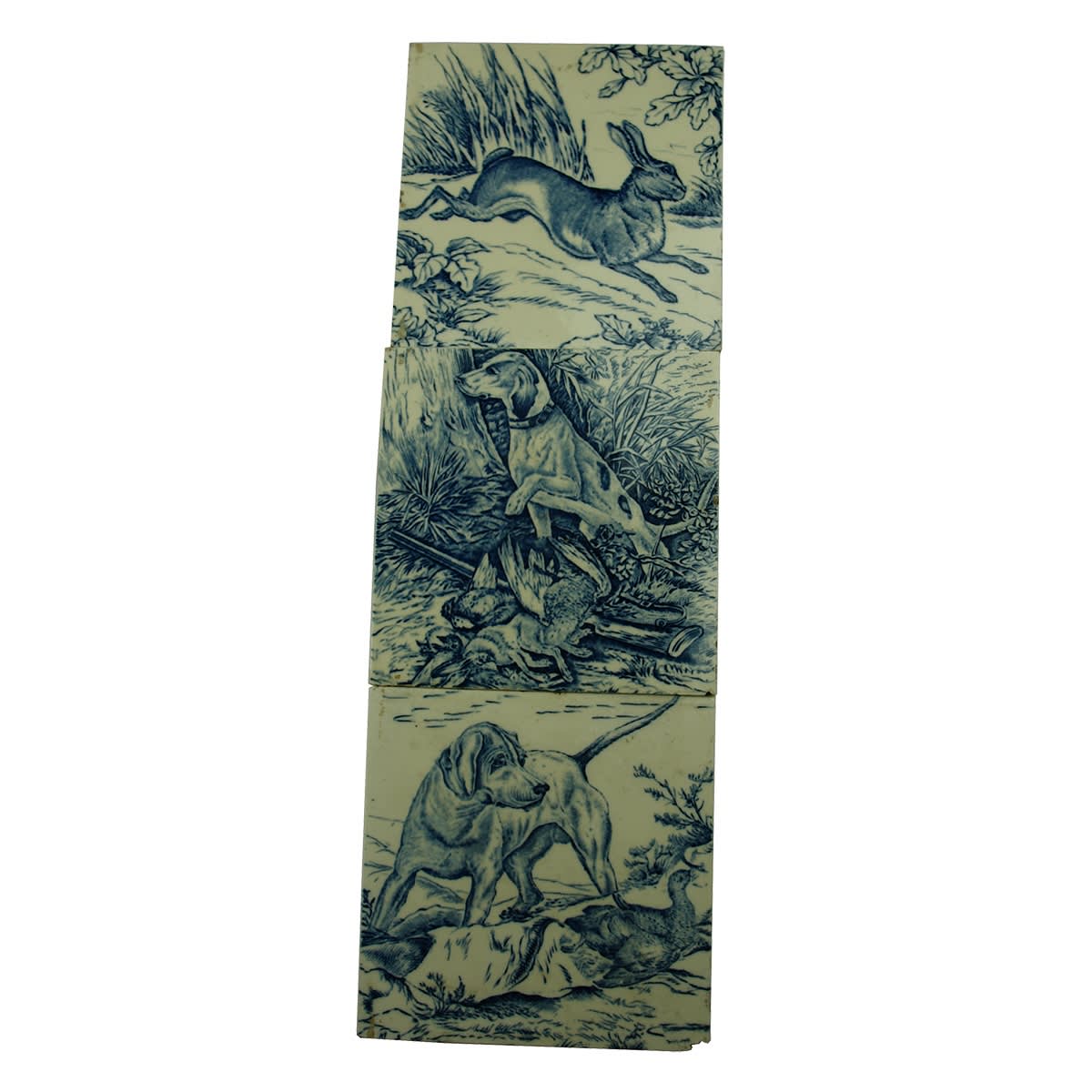 Pottery. Three Blue and White Tiles Depicting Hunting Themes: 1. Dog over Dead Rabbit and Bird with Gun on Ground. 2. Dog with Bird. 3. Running Rabbit.