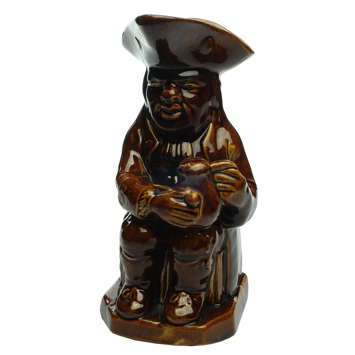 Moulded Pottery Jug. Toby Jug like. Seated man with a Tankard & a Pipe. Treacly like Rockingham Glaze. No markings.