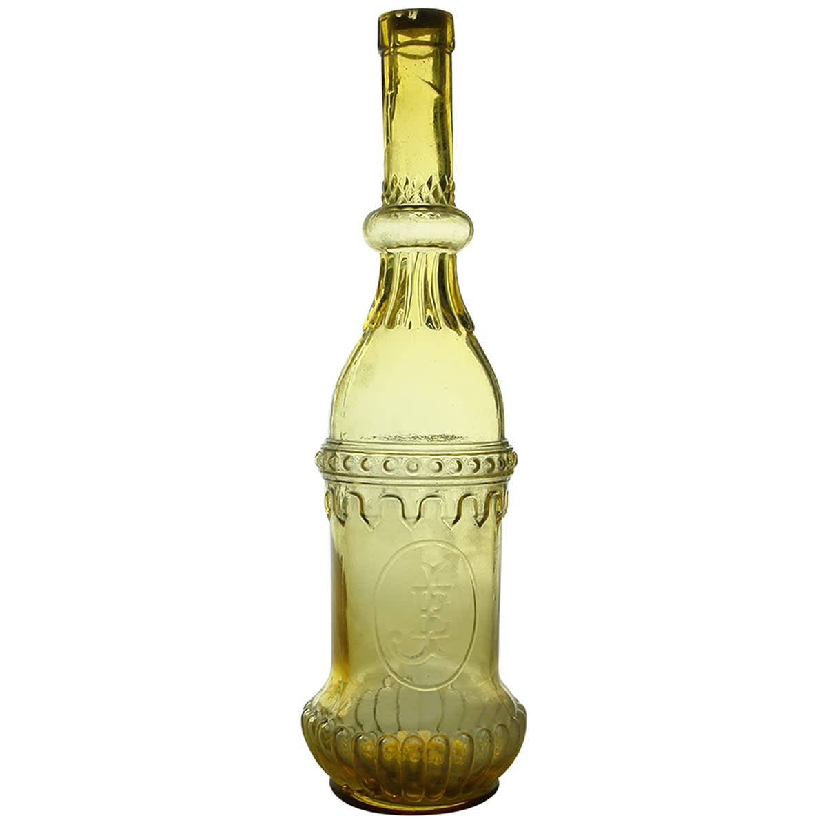 Household. Ornate honey amber bottle with JE monogram. 26 oz.