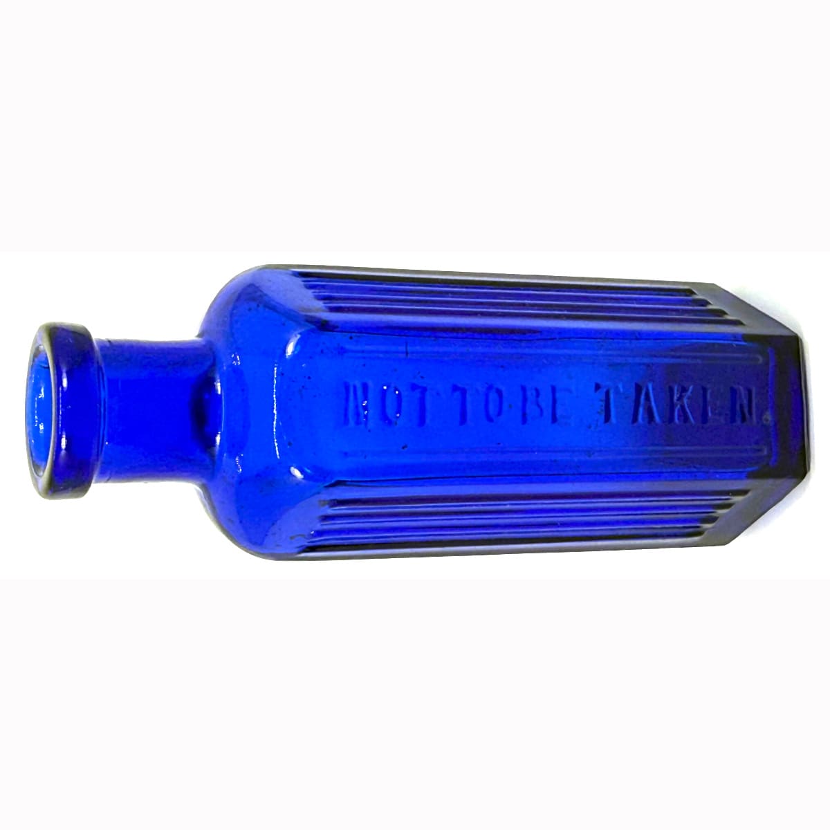 Poison. Not to be taken. Hexagonal. 4 raised vertical ribs to two sides. Modern AGM. Machine made bottle. 1.5 oz. 98 mm.