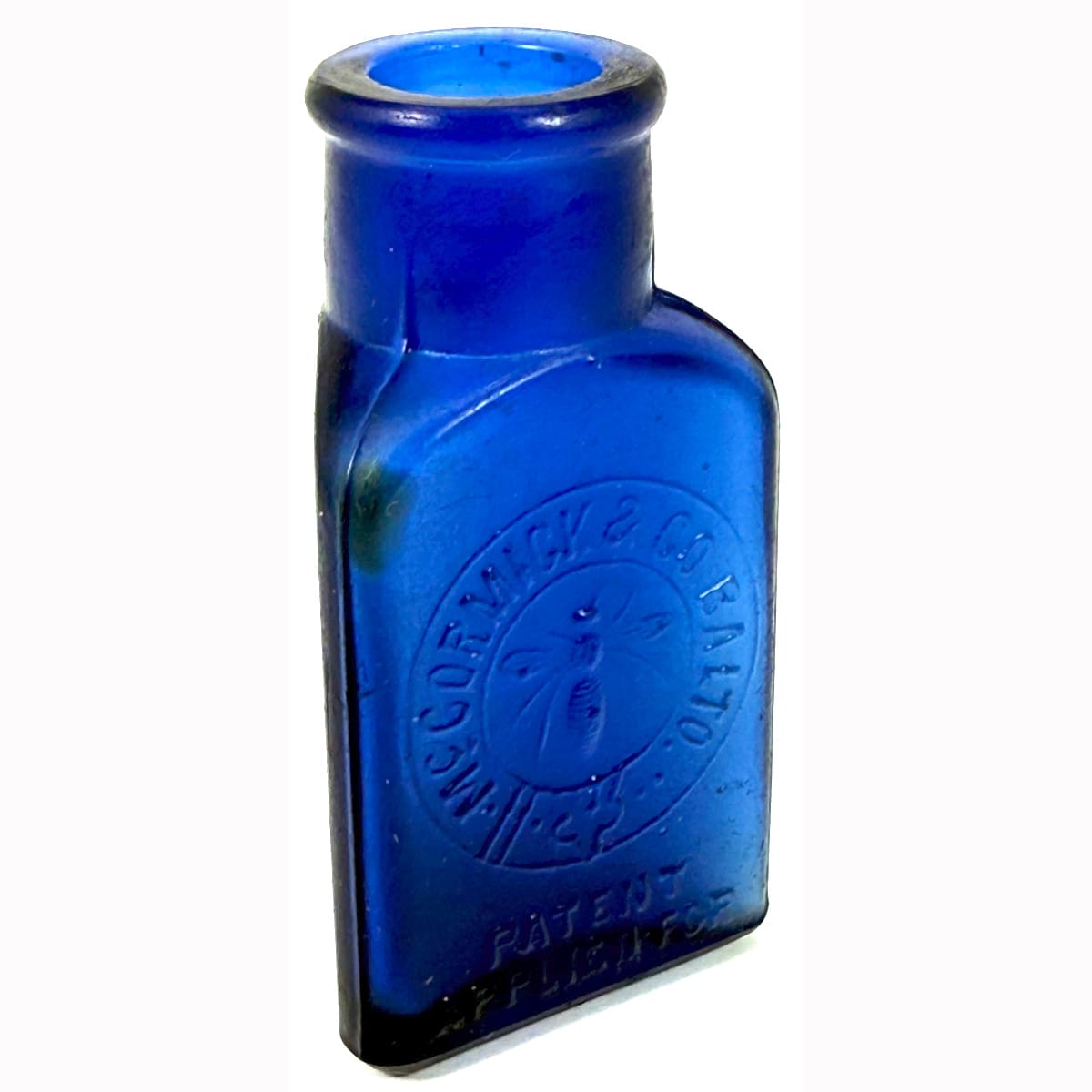 Medicine. McCormick & Co, Baltimore. Bee. Triangular. Cobalt Blue. 1 oz. 71 mm.