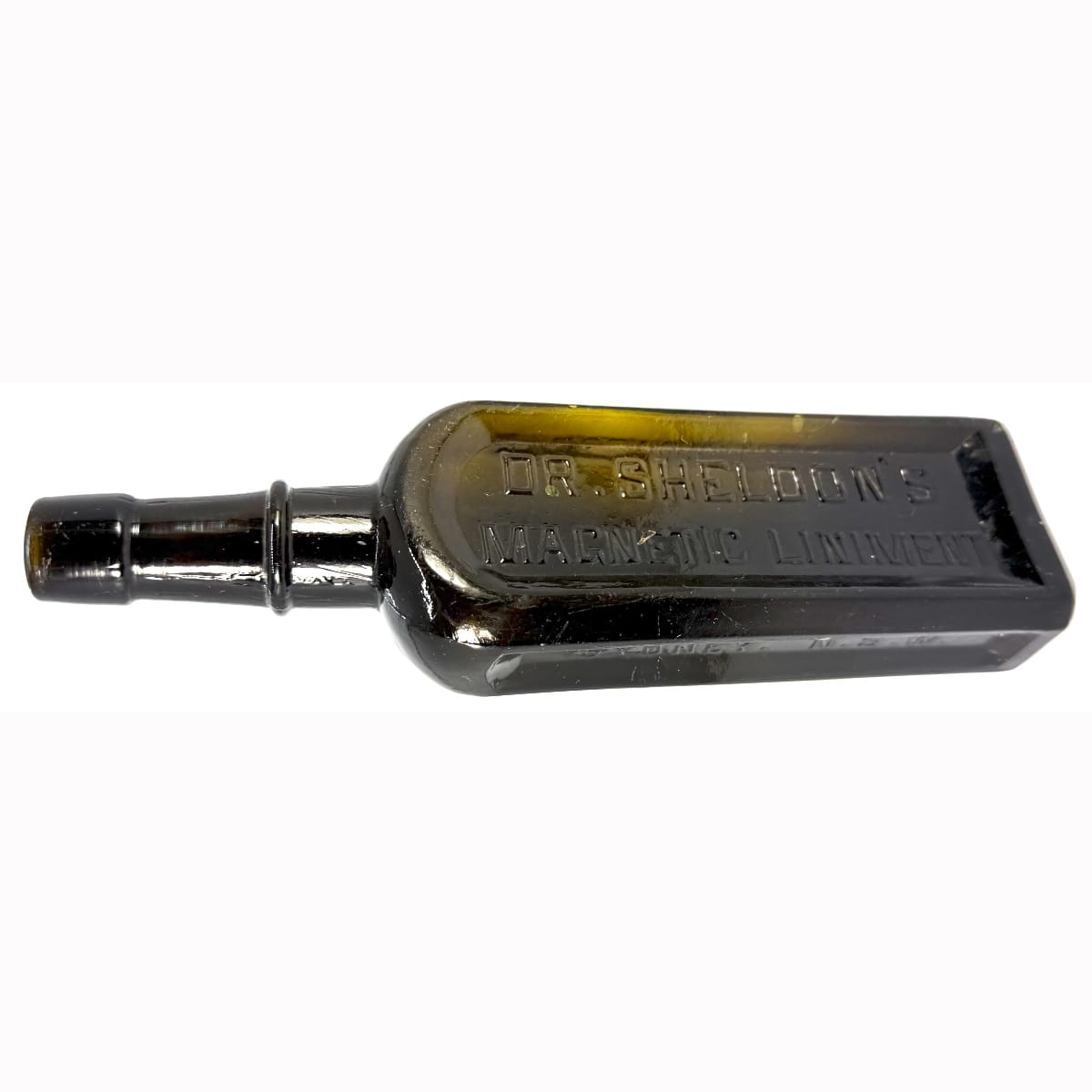 Medicine. Dr Sheldon's Magnetic Liniment. Boston. Sydney. Black - Dark Olive glass. 6 oz. 203 mm.