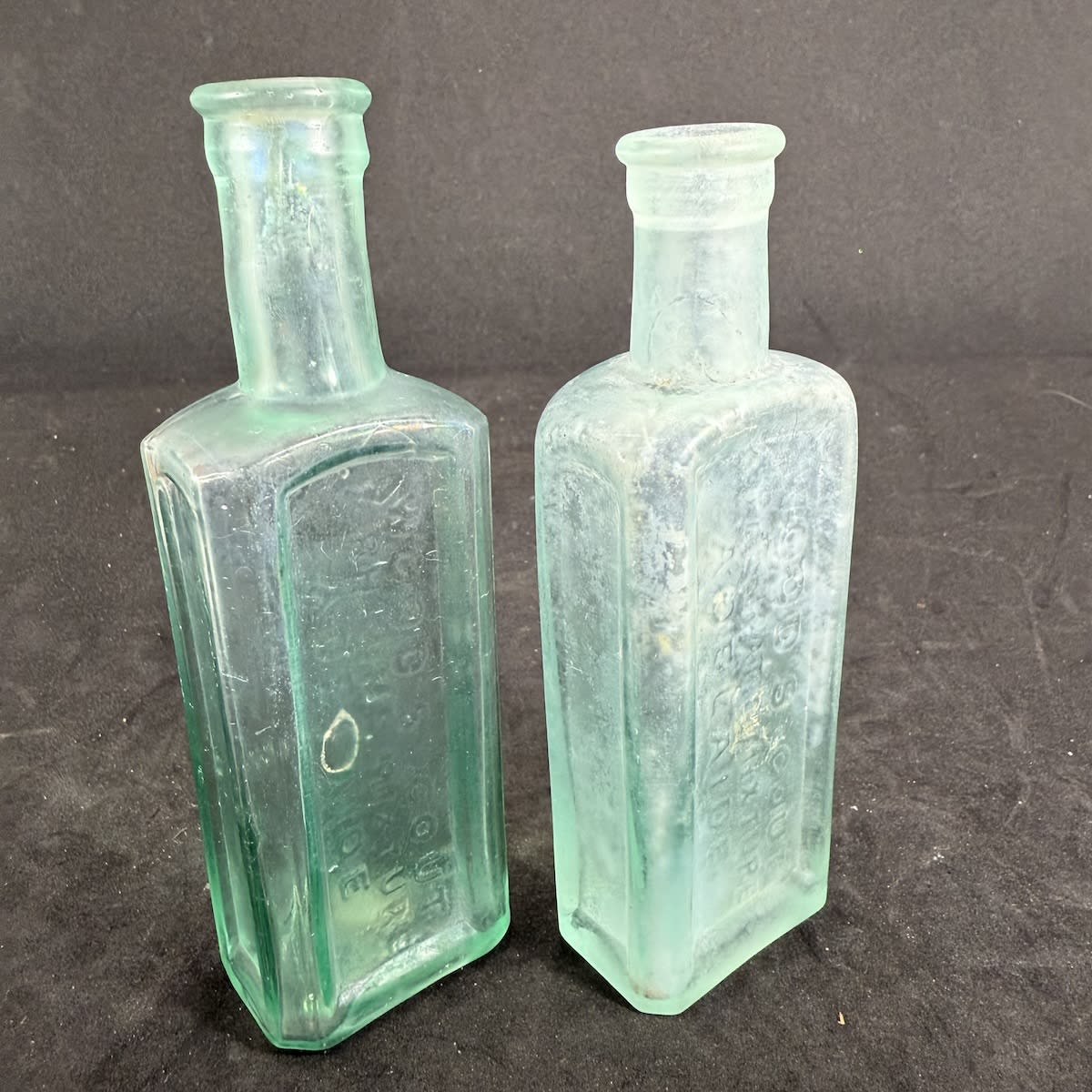 2 Cures. Both variations of Wood's Gout & Rheumatic Mixture Adelaide. One with FBH base and one plain base. 2 oz. 137 & 130 mm. (South Australia)