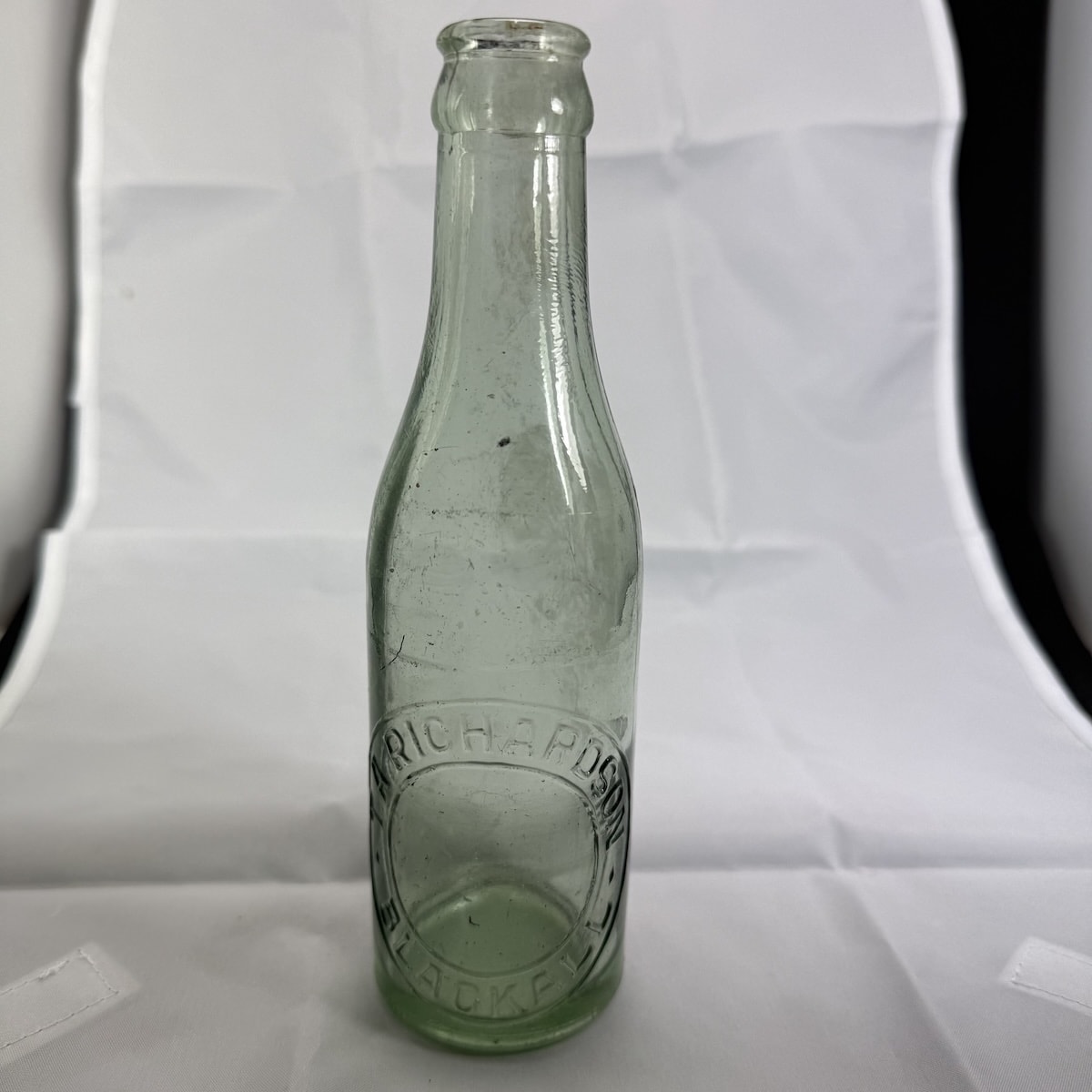 Crown Seal. T. A. Richardson, Blackall. Base mark is A and backwards 3. Crude machine made. 6 oz. (Queensland)