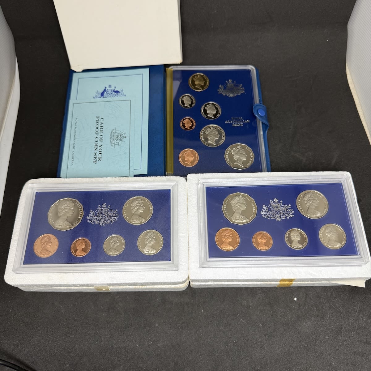 3 Australian Proof Coin Sets. 1980, 1983 & 1986. 6 coins in each of 1980 & 1983, 7 coins in 1986.