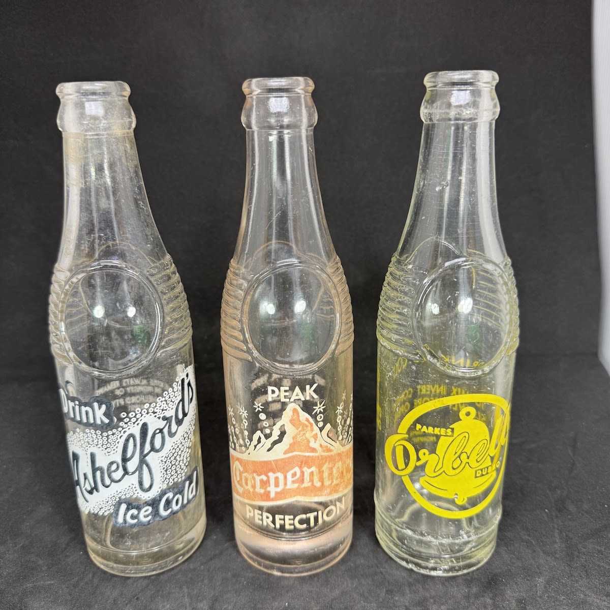 3 Ceramic Label Crown Seals: Ashelfords, Bathurst Carpenters, Peak Hill Orbells, Parkes & Dubbo. Bullet types. 7 oz. (New South Wales)