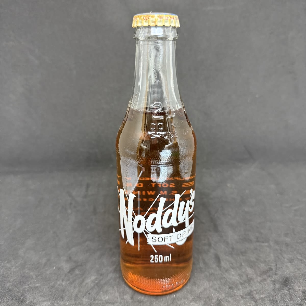 Ceramic Label Crown Seal. Noddy's Soft Drinks, Geelong & Melbourne. W. F. & S. M. Winter. 250 ml. Creaming Soda Cap & Contents. One Trippa. (Victoria)