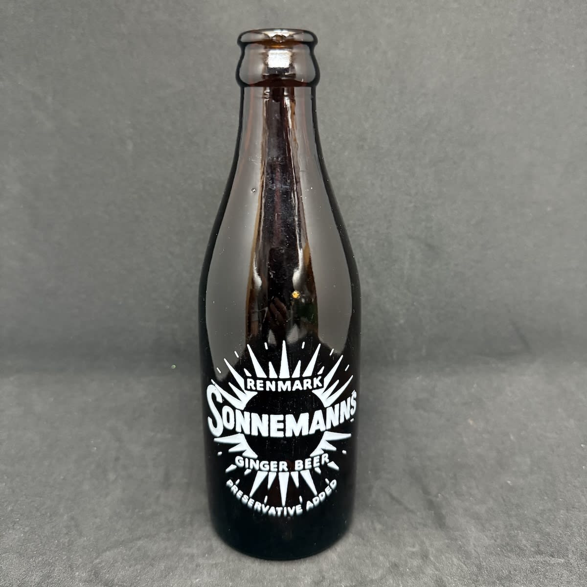 Ceramic Label Glass Ginger Beer. Sonnemann's, Renmark. White ceramic label. 8 oz. (South Australia)