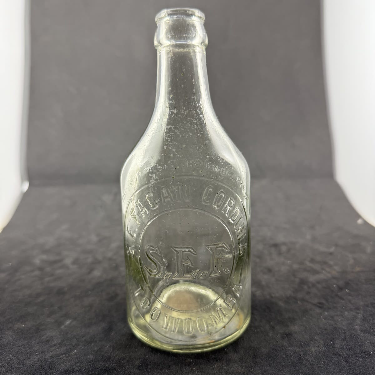 Crown Seal. S. E. Fagan, Toowoomba. Large outline initials. Dump. Clear. 10 oz. (Queensland)