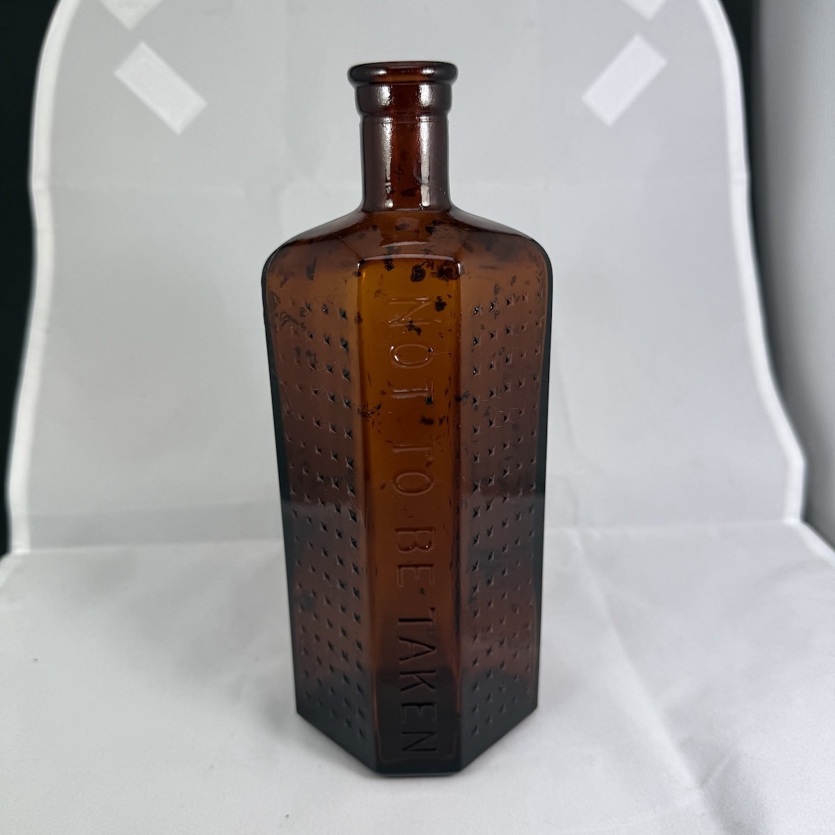 Poison. Not to be taken. Irregular Hexagon. Amber. Machine Made. 16 oz. AGM.