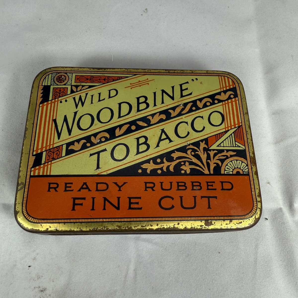 Tobacco tin. Wild Woodbine Tobacco. Ready rubbed Fine Cut. W. D & H. O. Wills Australia Ltd. Sydney.