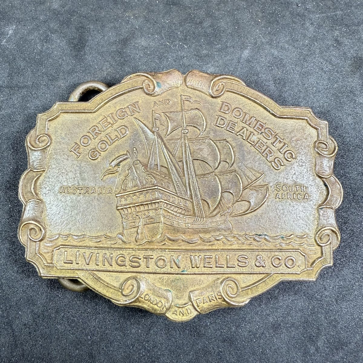 Modern Belt Buckle. Livingston Wells & Co. Sailing Ship. Foreign & Domestic Gold Dealers. Australia, South Africa, London and Paris.