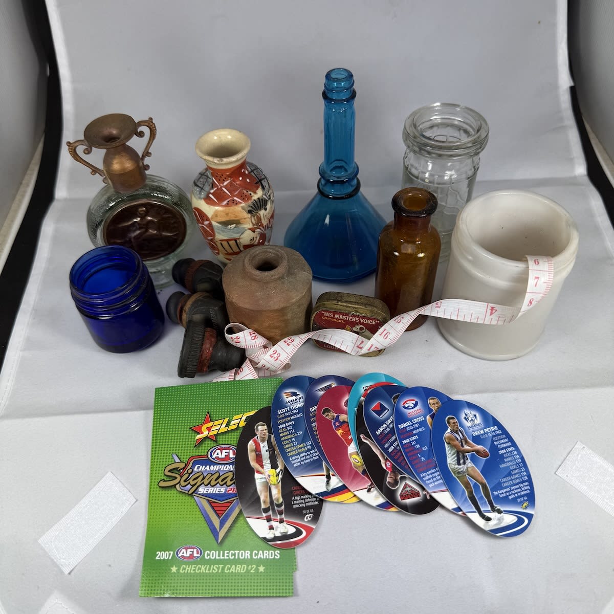 A bunch of small stuff! Chinese vase Gramophone needle tin Footy Cards and more. Pretty random selection!