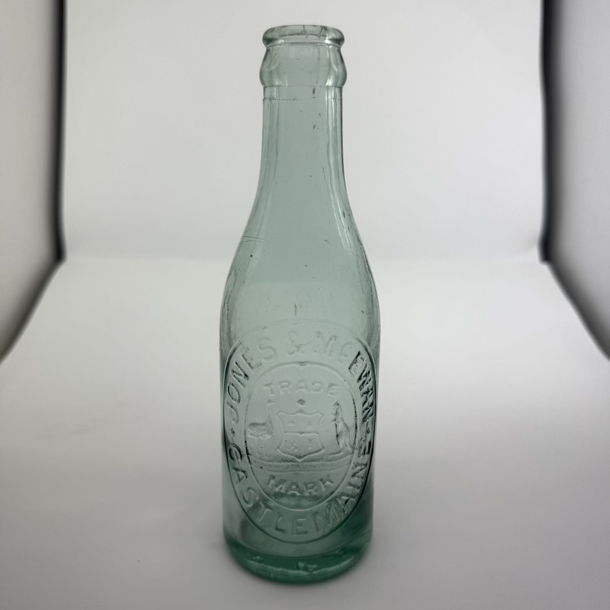 Crown Seal. Jones & McEwan, Castlemaine. Coat of Arms. Aqua. 6 oz. (Victoria)