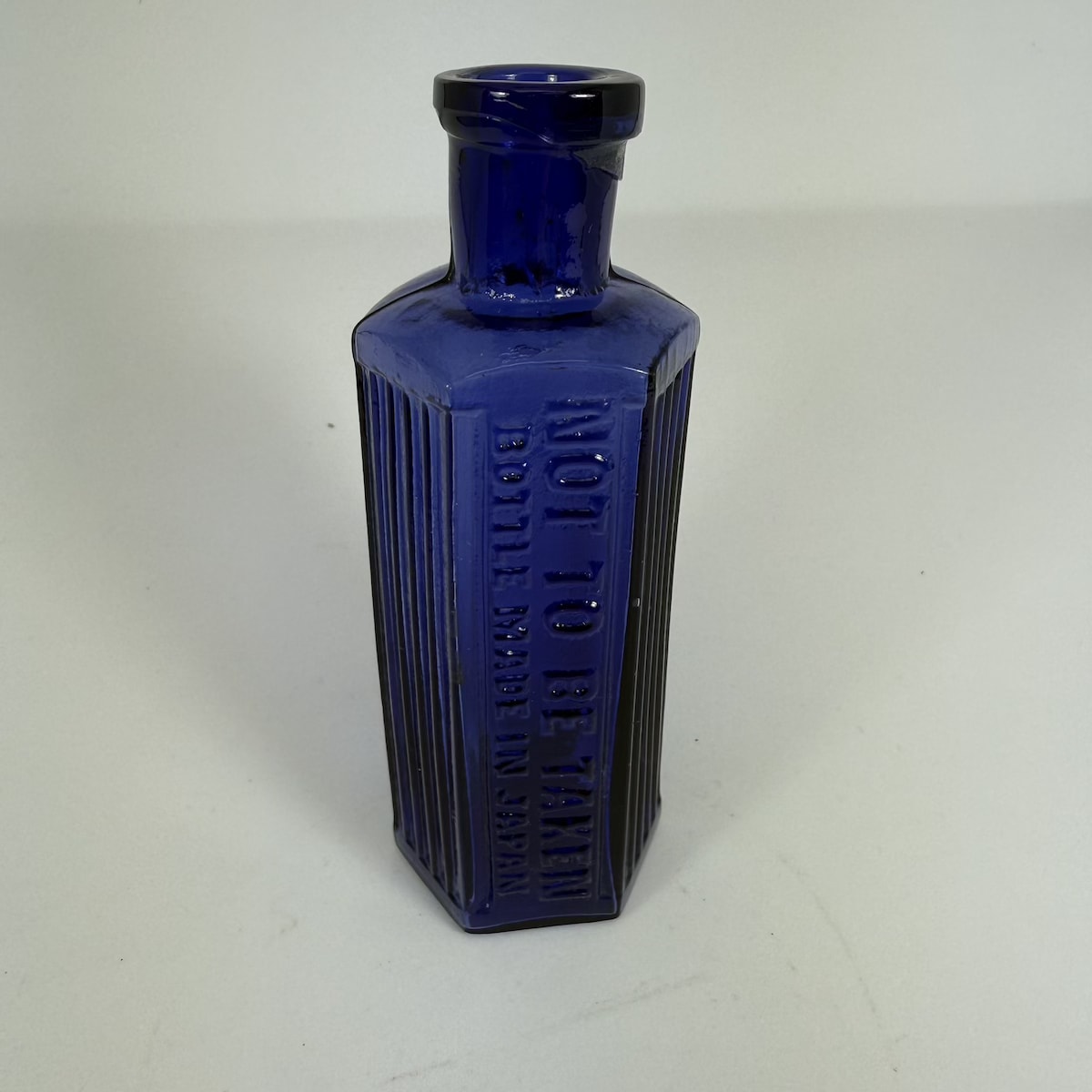 Poison. Not to be Taken. Bottle Made in Japan. Hexagonal. 2 oz. Purple/Violet colour!