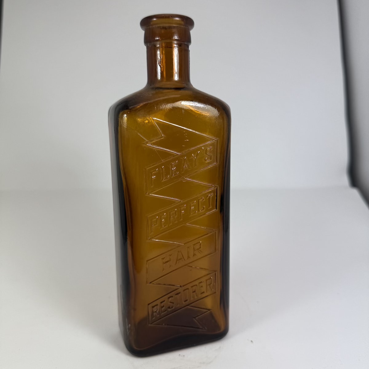 Hair Restorer. Fleay's Perfect Hair Restorer. Machine made type. Amber. 8 oz. (Ballarat, Victoria)