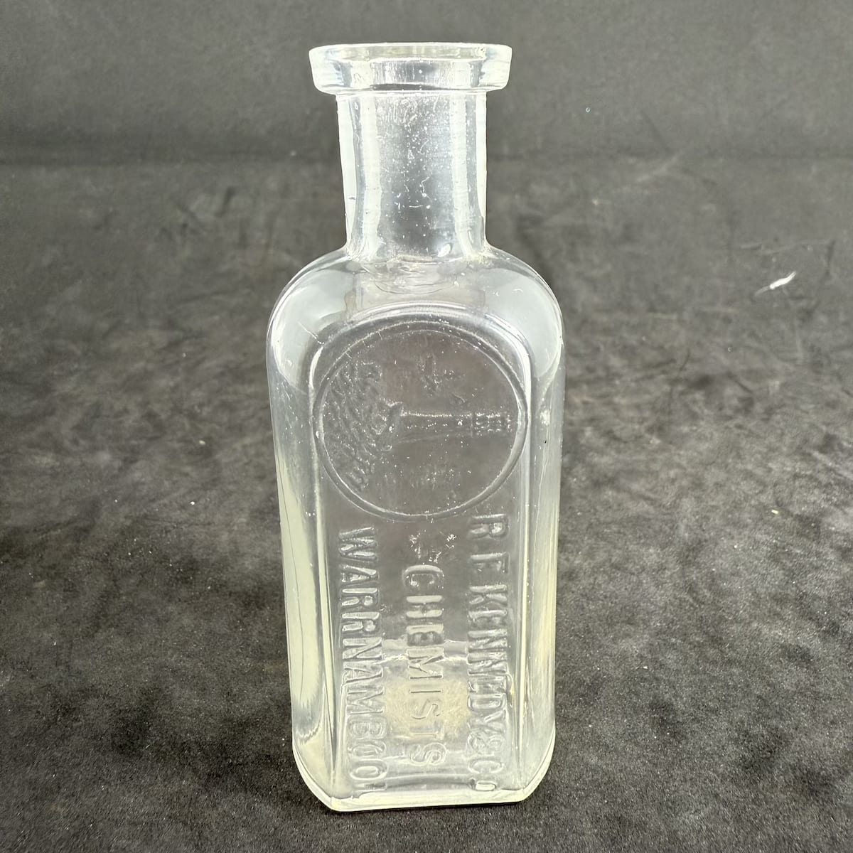 Chemist. R. F. Kennedy & Co., Warrnambool. Lighthouse. Clear. Whitall Tatum. 2 oz. 102 mm. (Victoria)