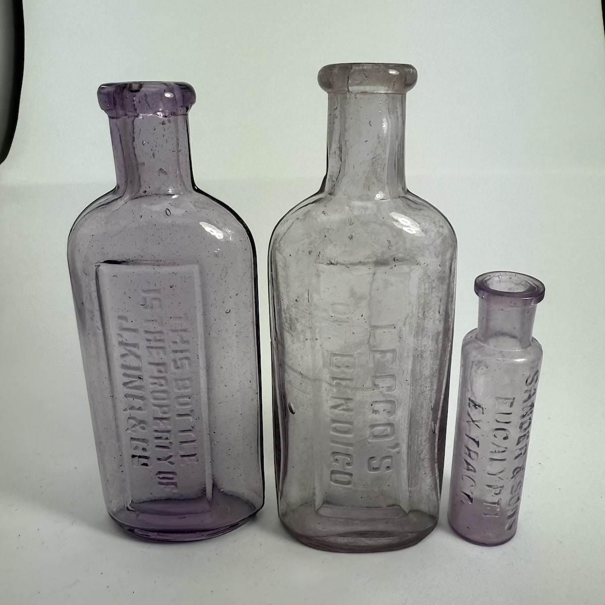 3 Eucalyptus Oil Bottles: J. King & Co; Leggo's of Bendigo; Sander & Sons Eucalypti Extract. All Sun Coloured Amethyst. (Victoria)