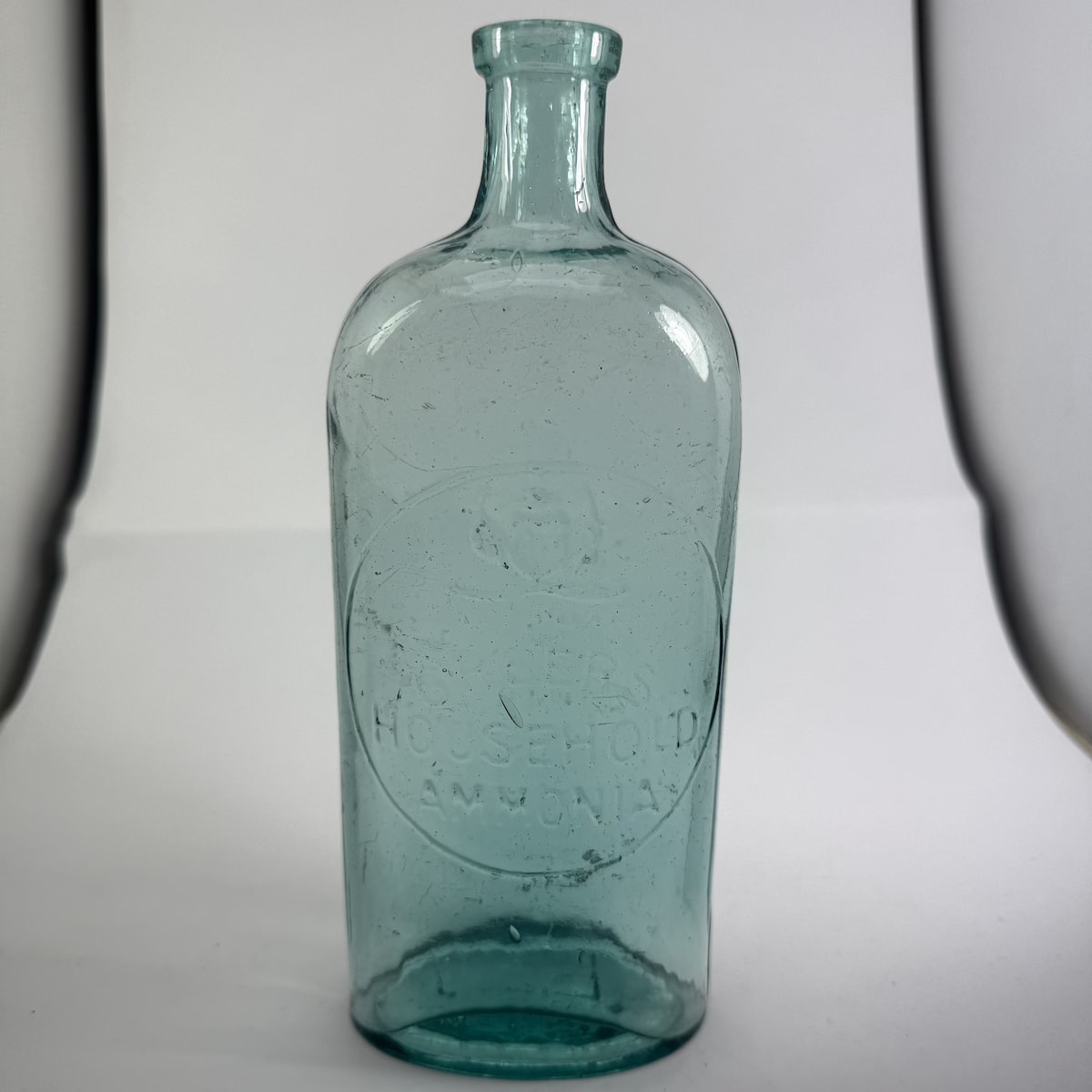 Disinfectant. Greer's Household Ammonia. Australian Coat of Arms. Botany Glass Works variety. (New South Wales)