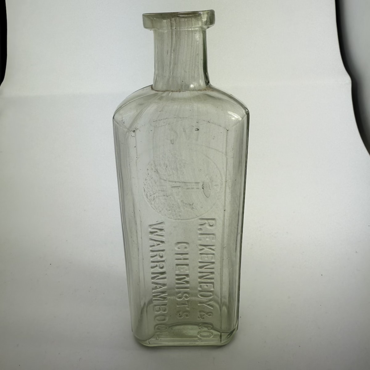 Chemist. R. F. Kennedy & Co., Warrnambool. Lighthouse. Clear. 6 oz. Melbourne Glass Works. 159 mm. (Victoria)