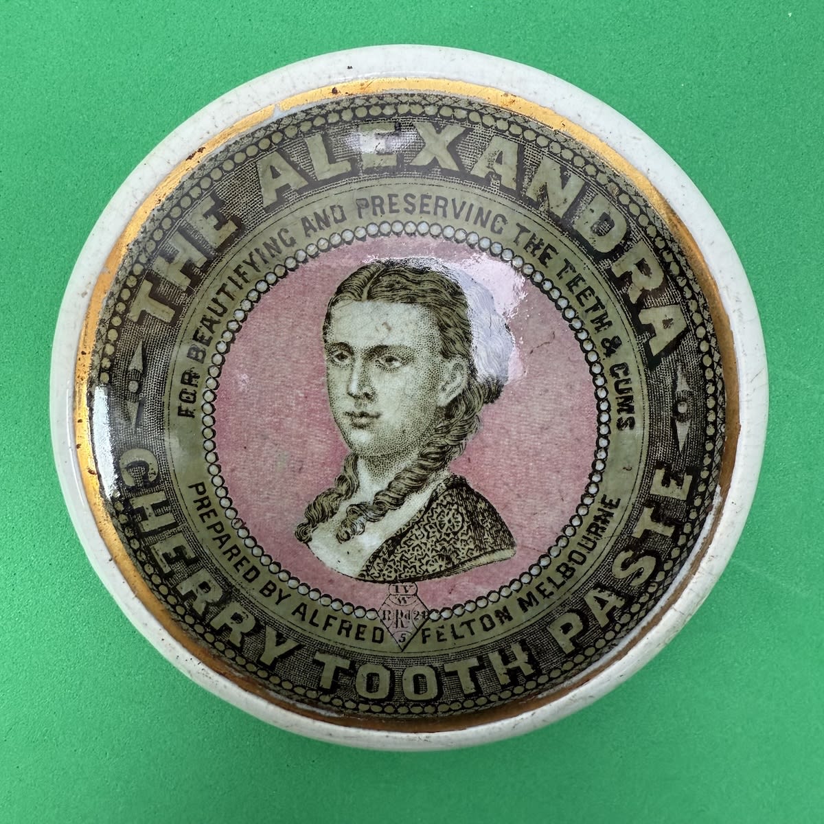 Pot Lid. The Alexandra Cherry Tooth Paste. Alfred Felton Melbourne. Registration Diamond 1865. Green border. Pink centre circle. (Victoria)