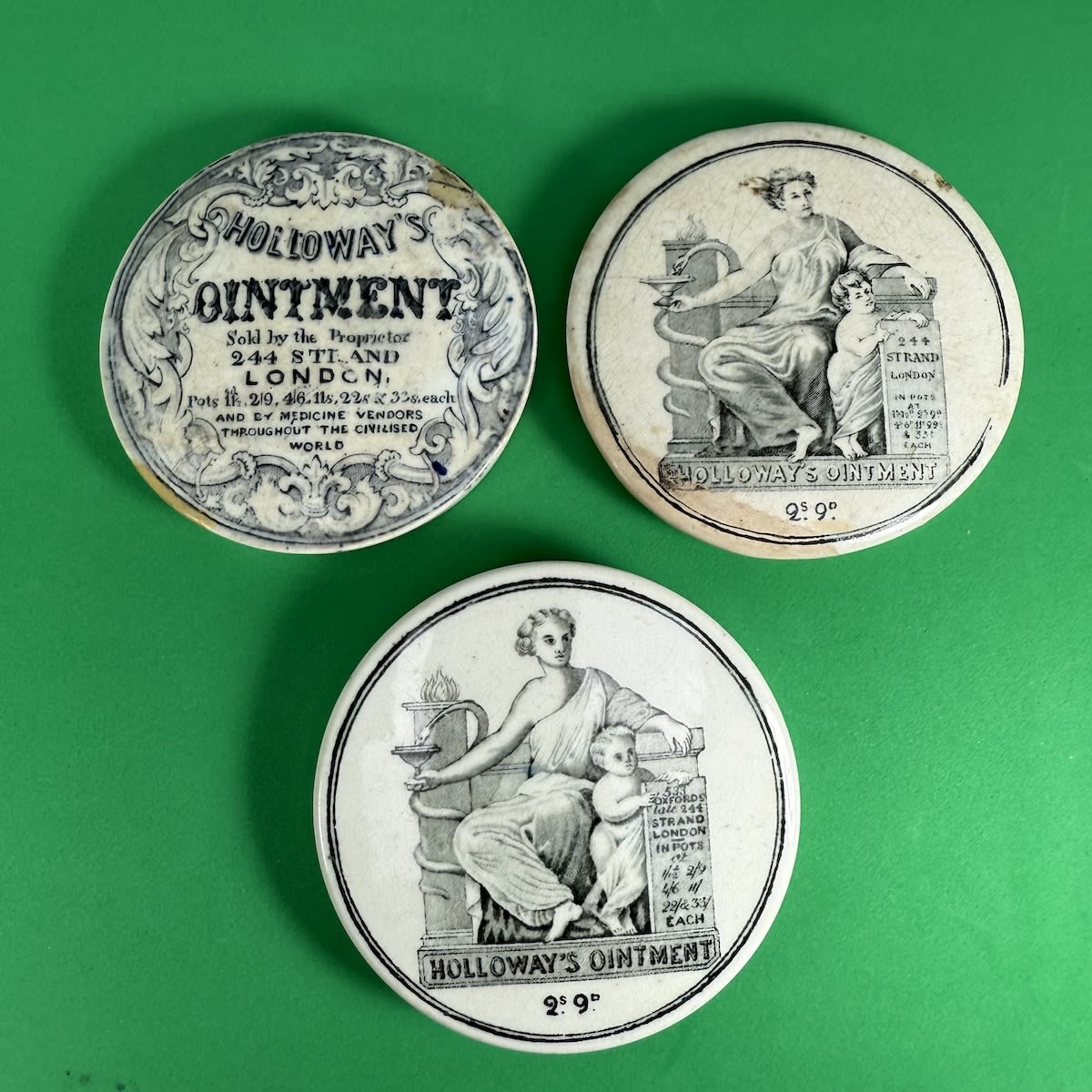 3 Holloway's Ointment Pot Lids. 244 Strand, writing and fancy border; 244 Strand, Hygeia, Snake, Cup, Cherub; 533 Oxford St, late 244 Strand, Hygeia etc.
