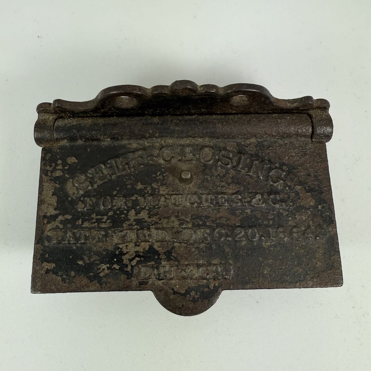 Vesta Case. Wall Holder. Self Closing for Matches. Patented December 20th 1864. Cast Iron. Striker on base.