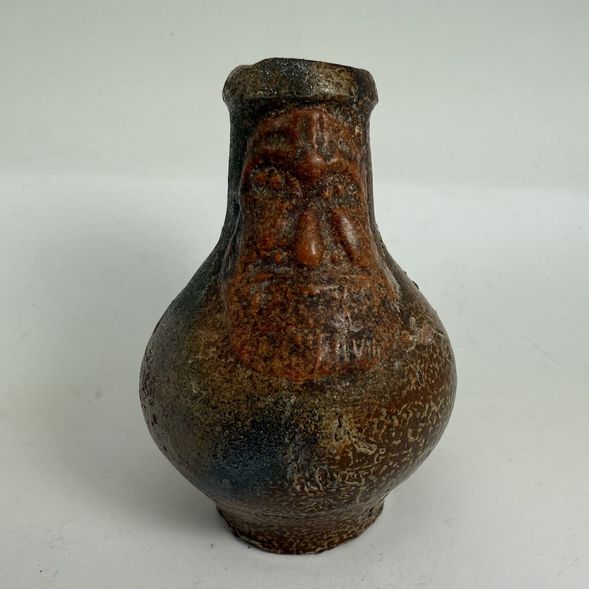Miniature or Small Bellarmine/Bartmann Jug. 99 mm tall. Face is added in a different material.