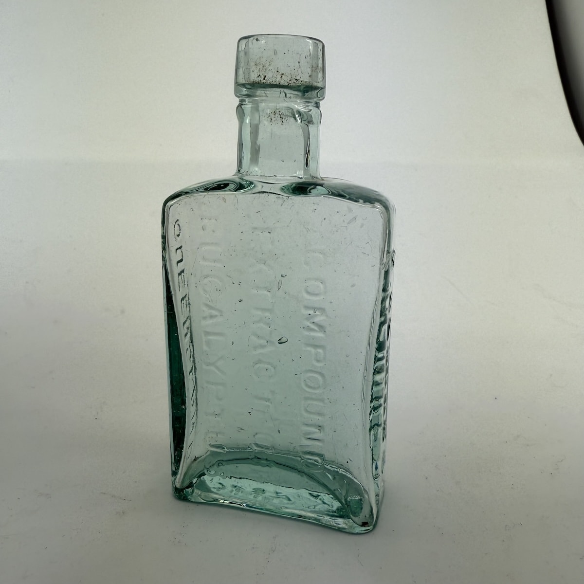 Eucalyptus Oil. D. Clarke's Compound Extract of Eucalyptus, Queensland. Kilner Bros made. Aqua. About 2 oz. 117 mm. (Queensland)