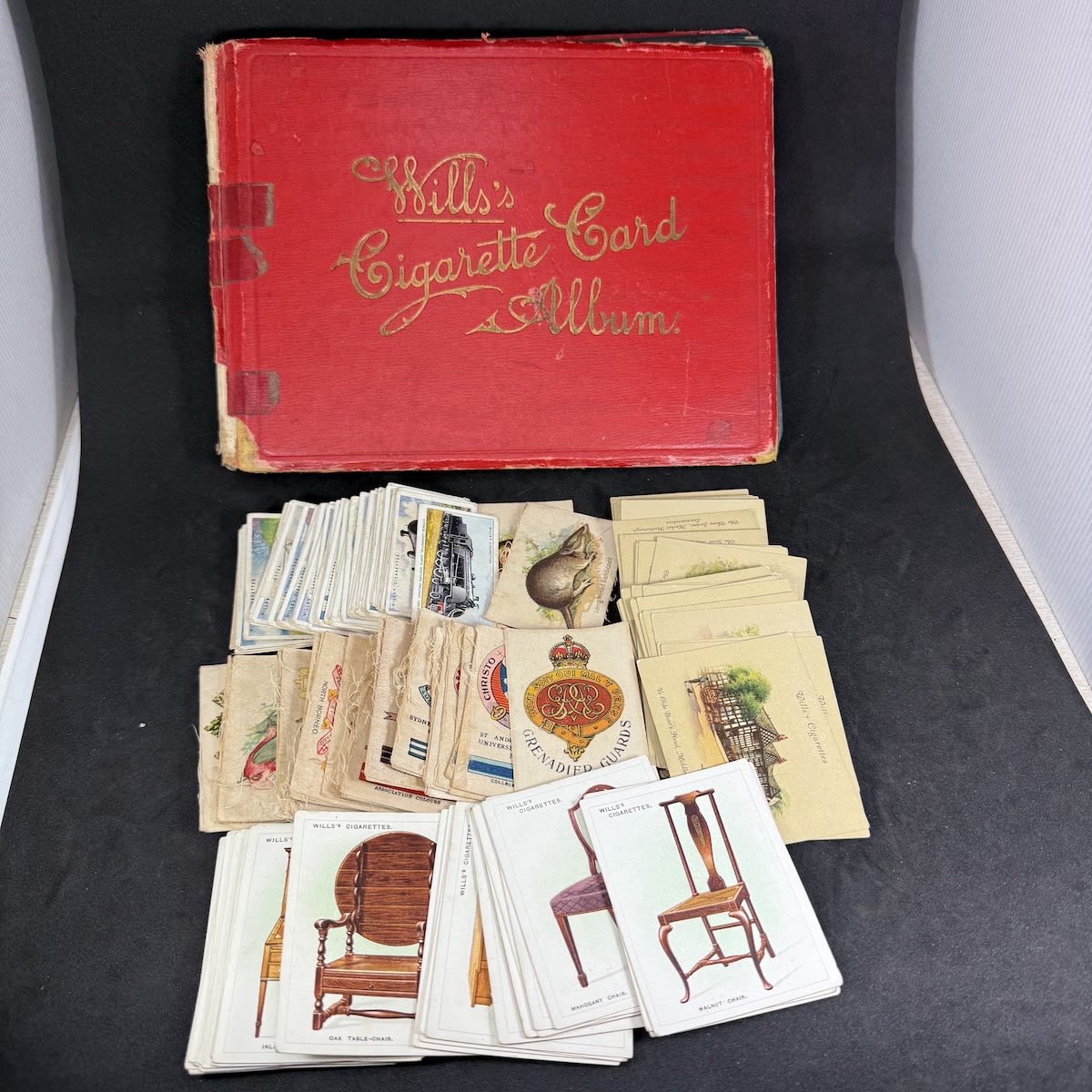 Big lot of cigarette Cards. Flags of Empire; Naval cards; Locomotives; Crests & Colours; Furniture; Buildings and more. Some in an album and more loose.