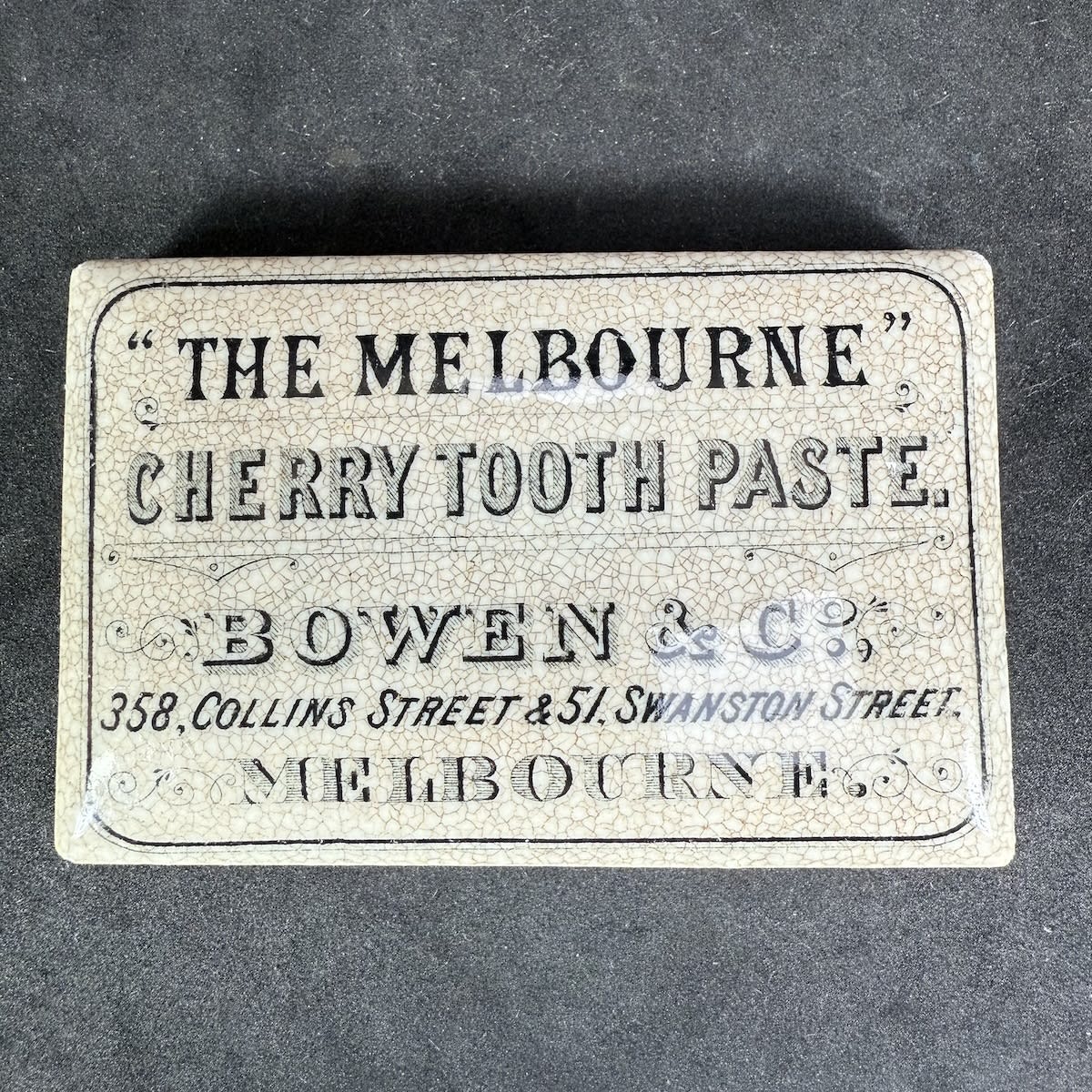 Pot Lid. Bowen & Co., The Melbourne Cherry Tooth Paste. 358 Collins Street, 51 Swanston Street. Rectangular. Black & White. (Victoria)