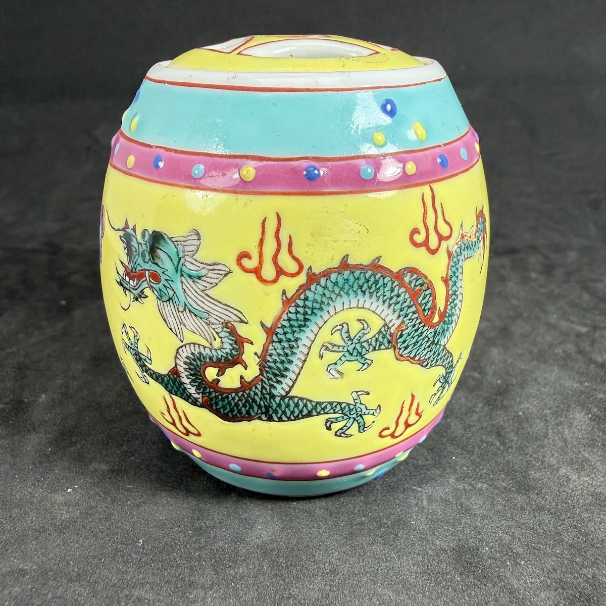 Small Lidded Japanese/Chinese style container. Multi coloured with Dragon decoration. Characters on the base.