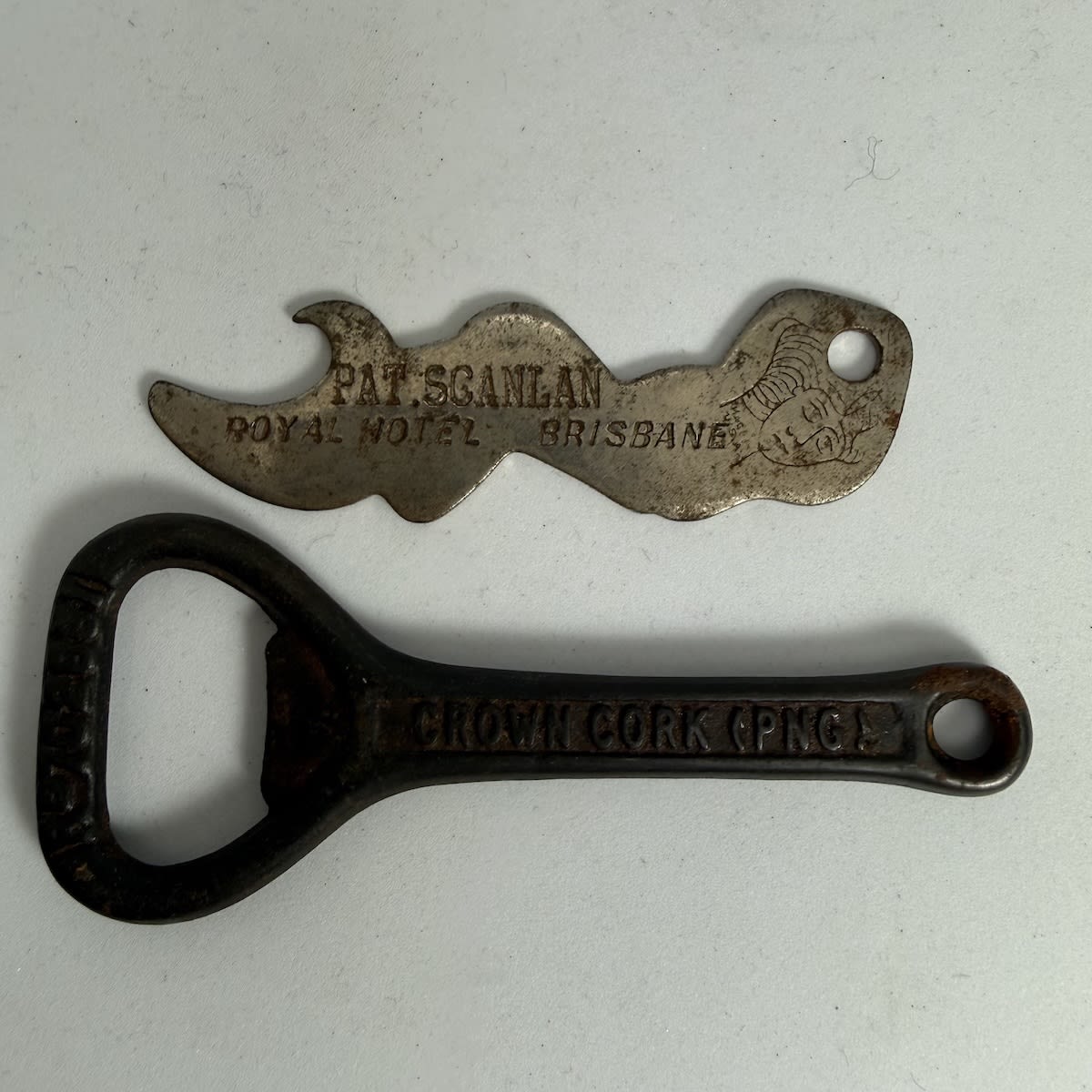 2 Bottle Openers: Crown Cork (PNG) S. P. No. 1; Mermaid shaped Keyring - Pat. Scanlan, Royal Hotel, Brisbane.